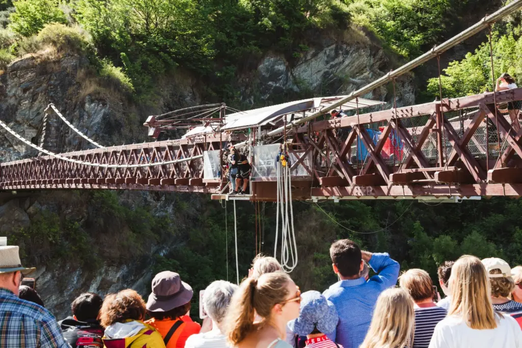 Crowd watching bungy activity on the historic Kawarau suspension bridge near Queenstown.