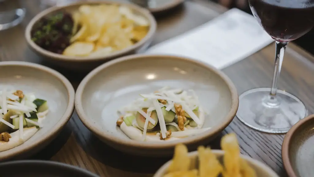Degustation dishes and wine served during the Milford Sound Business Class cruise