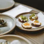 Fiordland-inspired degustation dishes served on the Milford Sound Business Class cruise