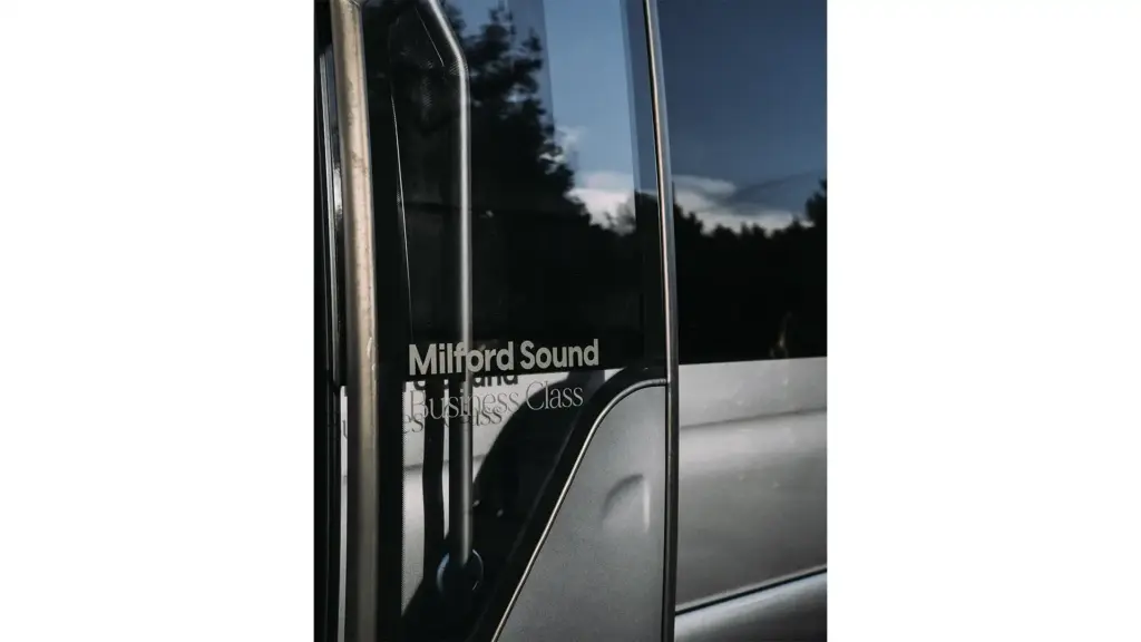 Milford Sound Business Class branding on an Altitude Tours premium vehicle