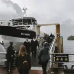 Guests boarding the MV Sinbad for a Milford Sound Business Class cruise in Fiordland National Park